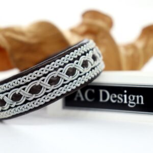 Elegant Sami bracelet named Trudvang. Handmade in genuine reindeer leather and pewter wire that contains 4 precent sterling silver. Label AC Design.